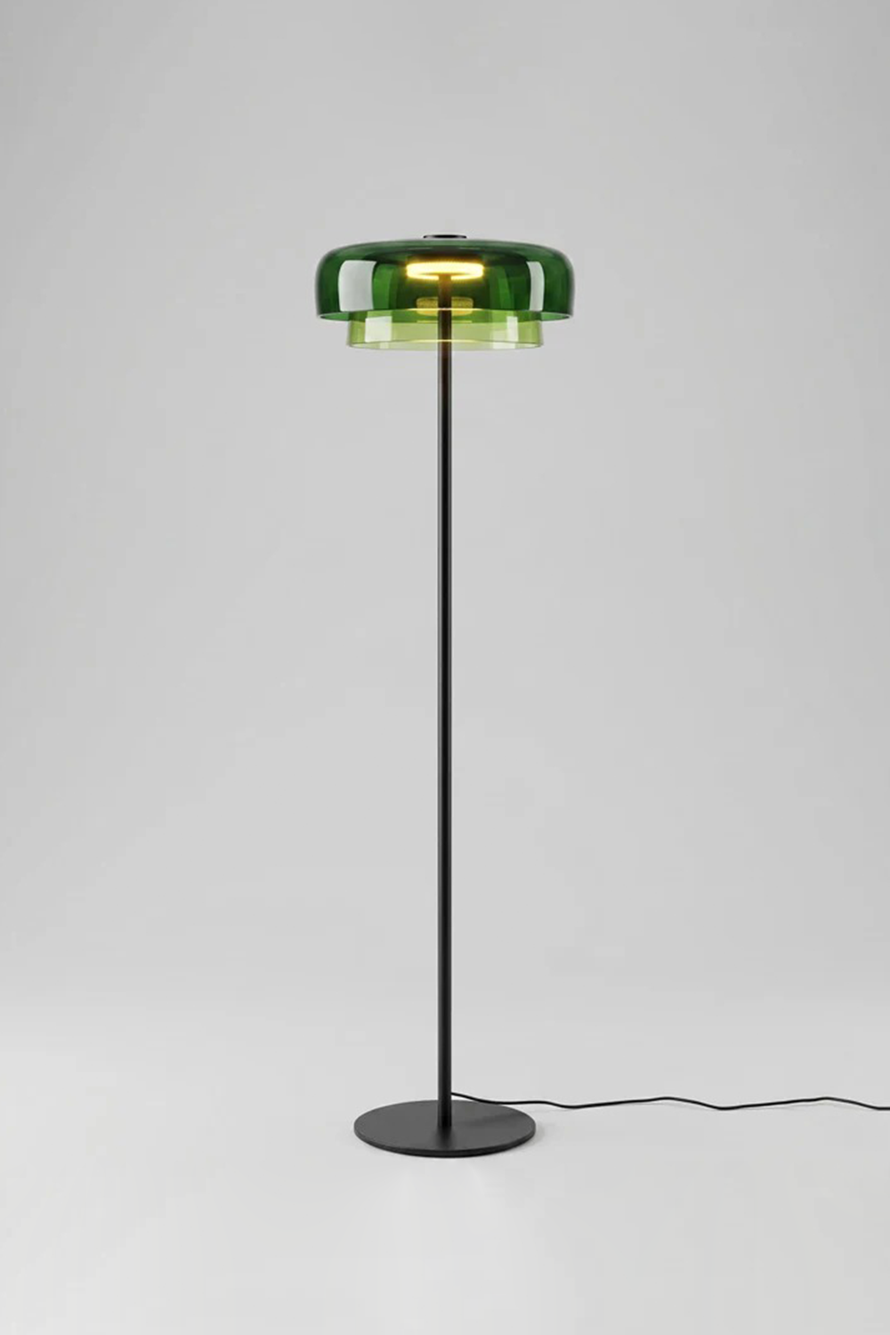 Aven Minimalist Architectural Floor Lamp | Glass, Metal | Studio product view of the fully lit green glass variant casting a crisp botanical glow against a plain white background | Samu Lamp