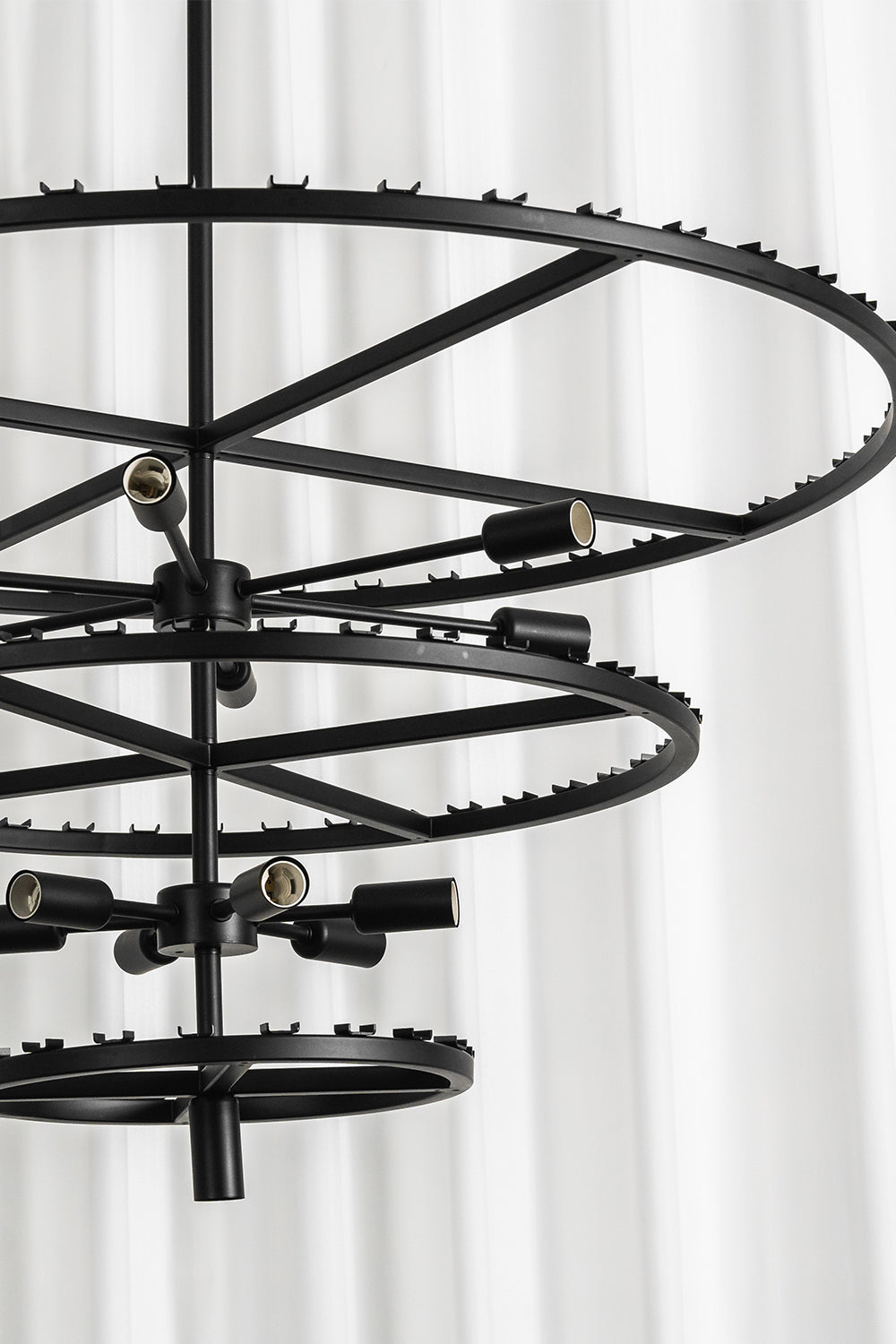 Aven Tiered Glass Prism Chandelier | Glass, Metal | Direct view of the empty multi-tiered concentric black metal frame structure before glass link installation | Detail shot | Samu Lamp