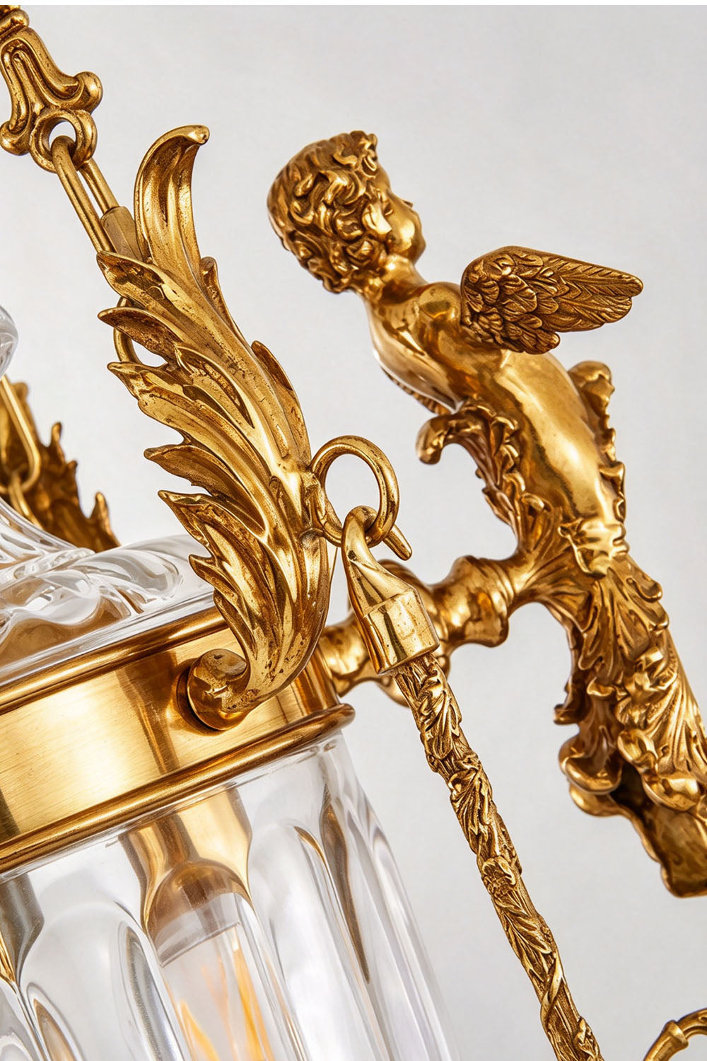 Aveyron Brass Urn Candle Chandelier | Solid Brass and Glass | Close-up view showing the brass angel figurine and rococo scrollwork | Samu Lamp