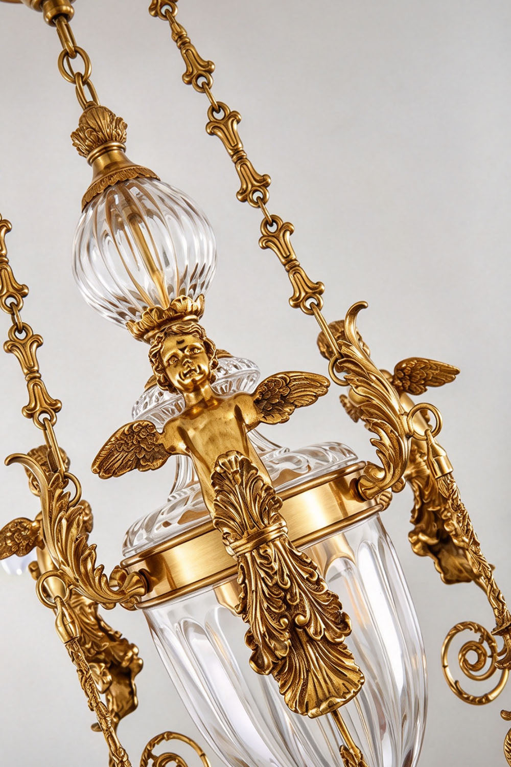 Aveyron Brass Urn Candle Chandelier | Solid Brass and Glass | Close-up view of the brass hanging chains, glass urn, and candle arms | Samu Lamp