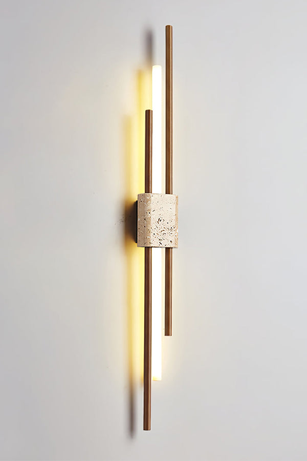 Detailed close-up of Axis Terra wall light | Travertine, Metal, Glass | Showing the lit glass tubes and stone texture | Samu Lamp