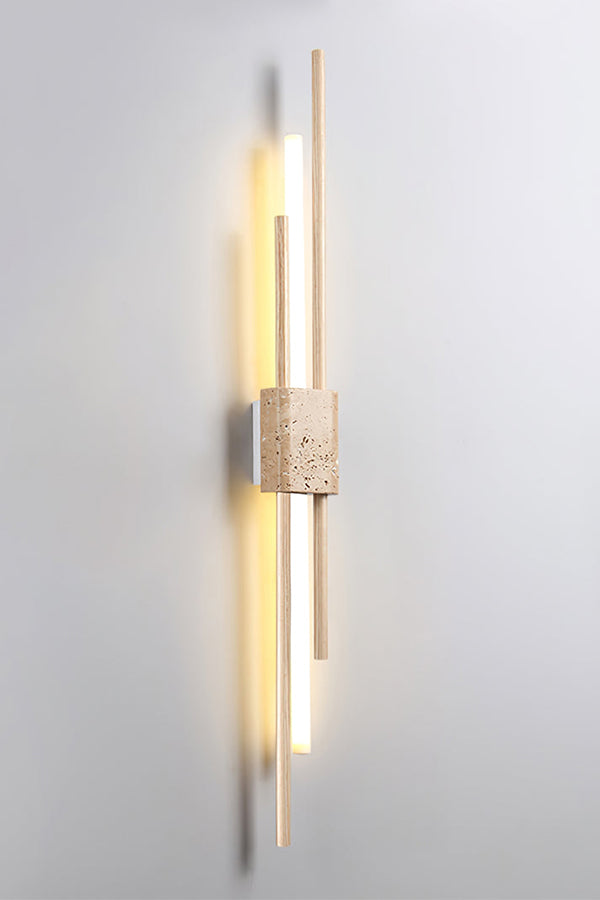 Detailed close-up of Axis Terra wall light | Travertine, Metal, Glass | Showing the lit glass tubes and stone texture | Samu Lamp