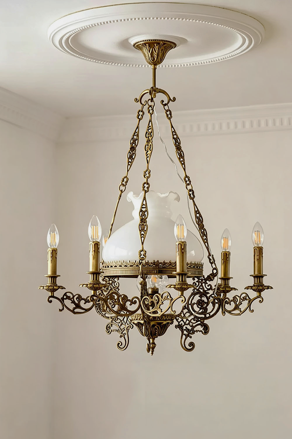Barnaby Domed Glass Brass Chandelier featuring ornate metalwork and elegant light bulbs.
