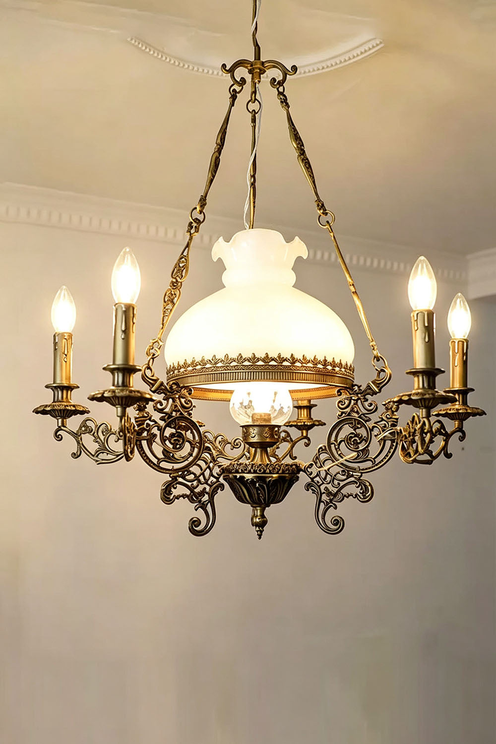 Barnaby Domed Glass Brass Chandelier with intricate detailing and soft glow from five lights.