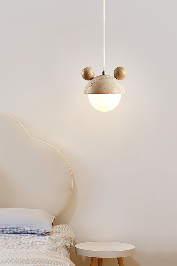 Bear ear stone pendant lamp in a serene bedroom | Travertine, Metal, Glass | Hanging near a cream headboard | Samu Lamp