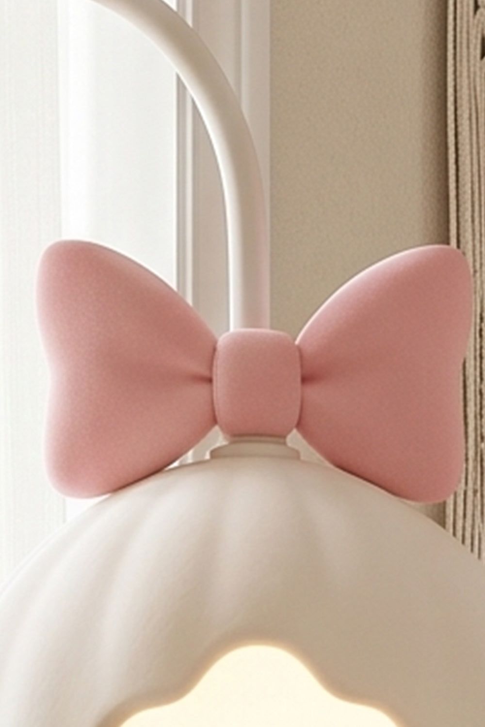 Bella Bow Arched Floor Lamp | Metal, Resin | Macro close-up focus on the cute molded pastel pink bow knot detail sitting atop the white scalloped lampshade | Detail shot | Samu Lamp