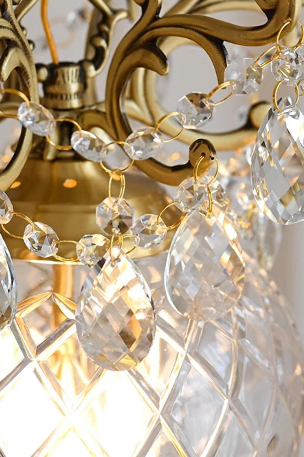 Close-up of Bertrand Cut Glass Teardrop Pendant Light showcasing crystal teardrops and ornate gold design.