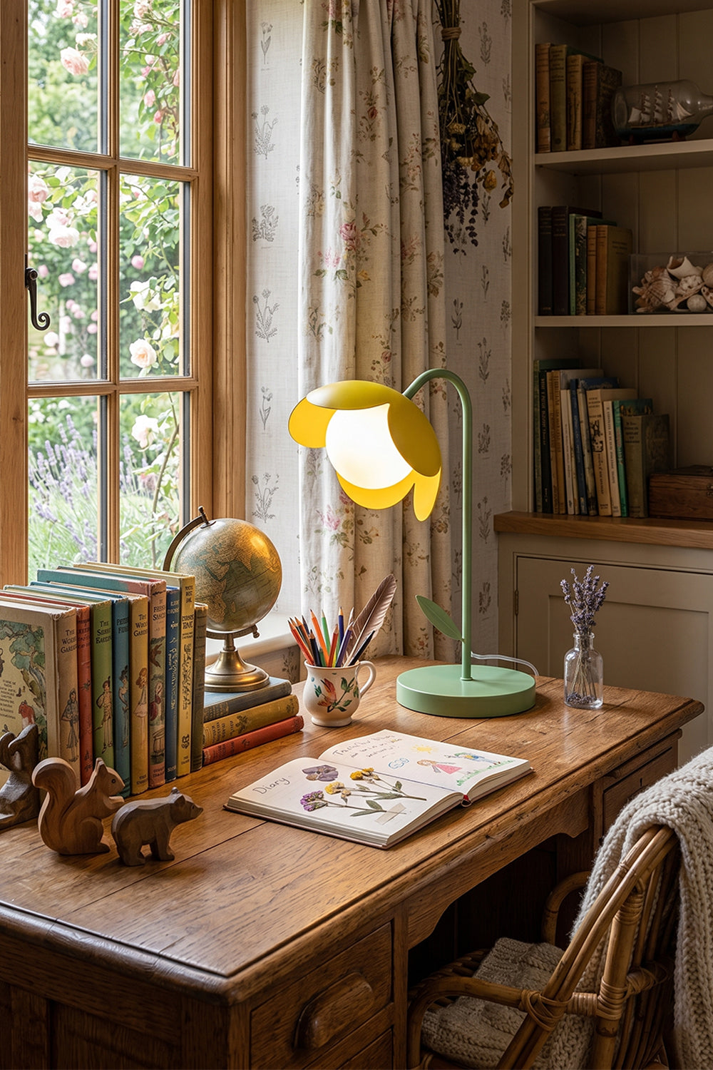Classic vintage study room desk scene | Metal and glass | Yellow petal botanical lamp on wood desk | Quill pen, classic books, vintage globe | Intricate wood grain | Samu Lamp