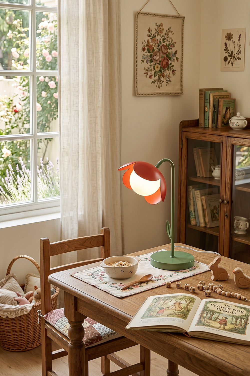 Cozy rustic living area scene | Metal and glass | Red petal botanical lamp on wooden dining table | Large window and cabinet | Floral decor | Samu Lamp