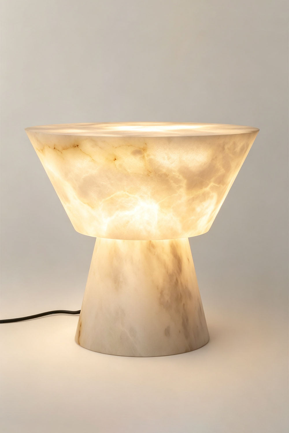 Bramwell Chalice Alabaster Table Lamp | Natural Alabaster | Full illuminated view displayed against a light neutral background | Samu Lamp