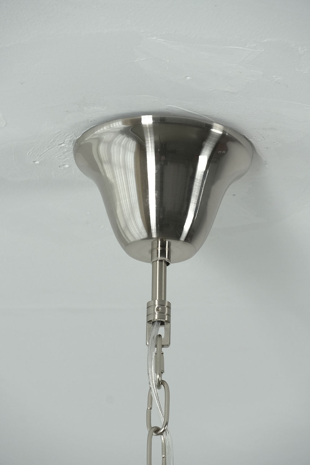 Brevalle Mini Chandelier | Brushed Nickel Finish | Close-up of conical ceiling canopy and chain connector | Samu Lamp