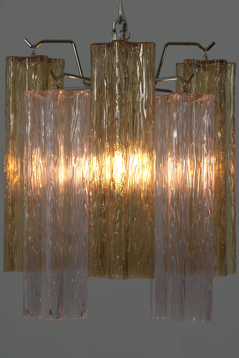 Brevalle Mini Chandelier | Textured Glass and Metal | Lit close-up showcasing warm glow through ribbed tubes | Samu Lamp
