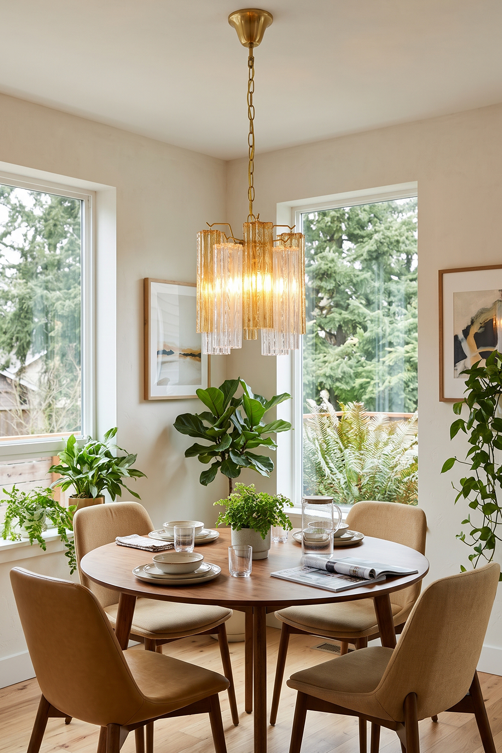 Brevalle Mini Chandelier | Fluted Glass and Nickel | Suspended over dining table set with potted plants | Samu Lamp