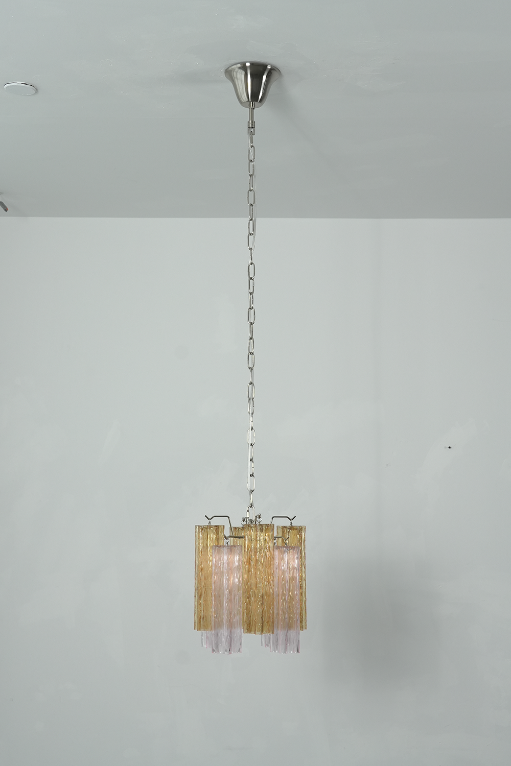Brevalle Mini Chandelier | Textured Glass and Nickel | Full drop view with chain on clean white wall, unlit | Samu Lamp