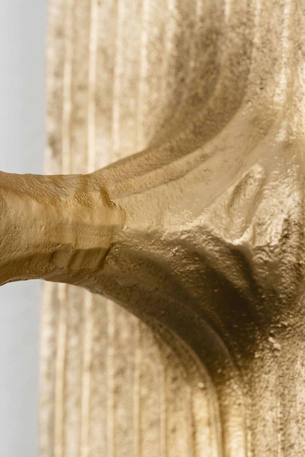 Close-up detail of the Bryony Torch Alabaster Brass Wall Lamp showcasing textured brass finish.