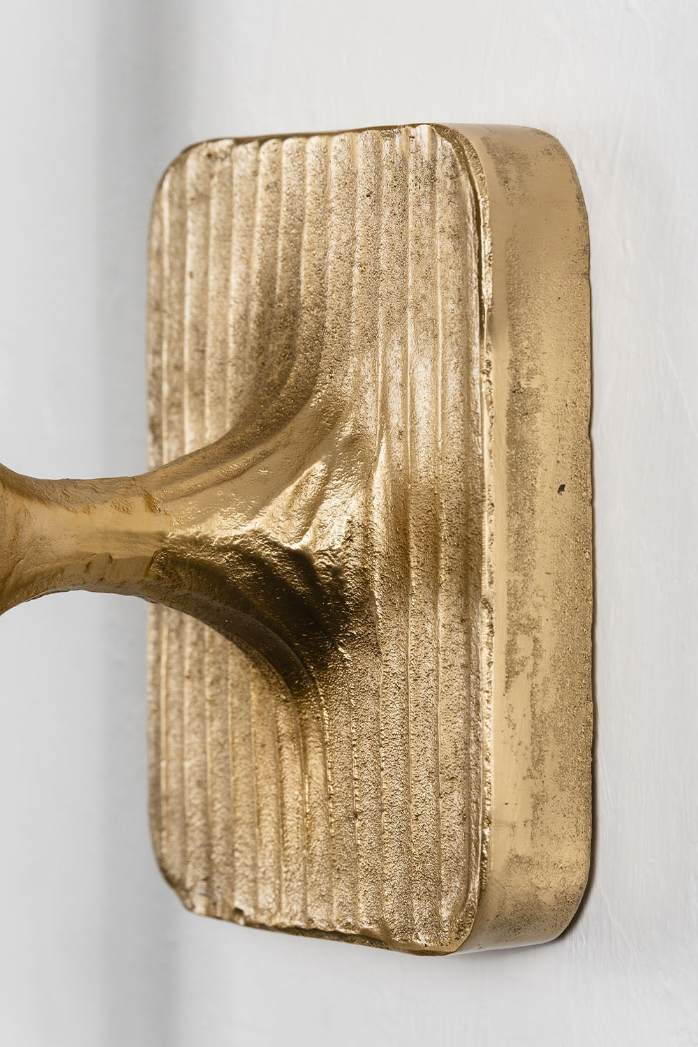 Close-up of the Bryony Torch Alabaster Brass Wall Lamp showcasing its elegant gold finish.