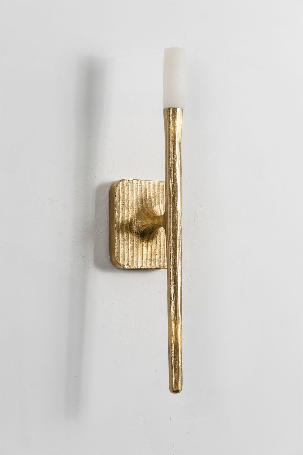 Bryony Torch Alabaster Brass Wall Lamp in a modern gold design with a sleek stick shape and frosted glass shade.