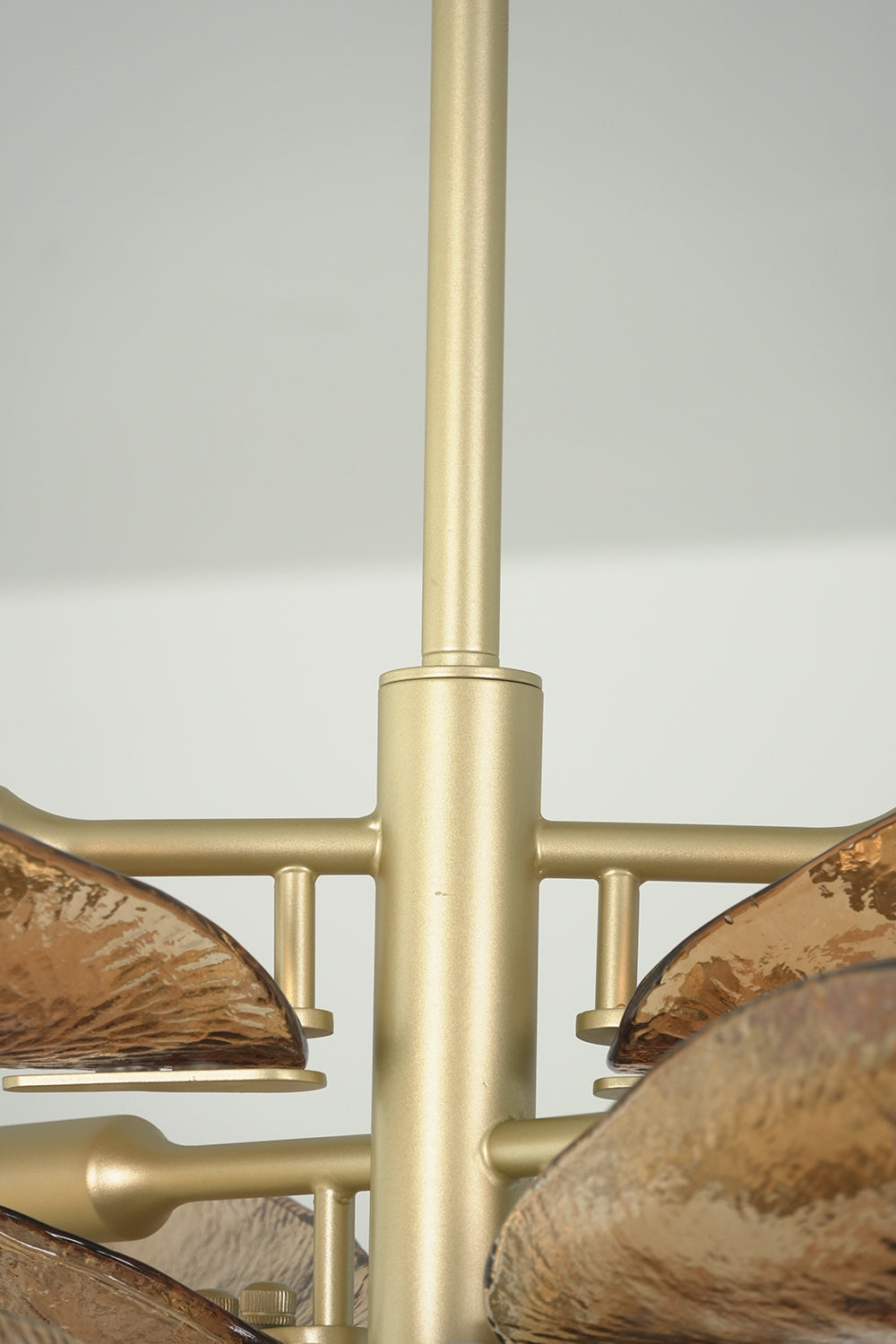 Brass central rod and glass branch connection detail | Metal, Glass | Functional close-up of the Cardiff chandelier frame | Samu Lamp