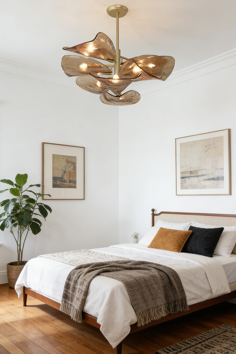 Cardiff Textured Wave Chandelier | Metal, Glass | Installed in a modern bedroom over a white bed | Samu Lamp