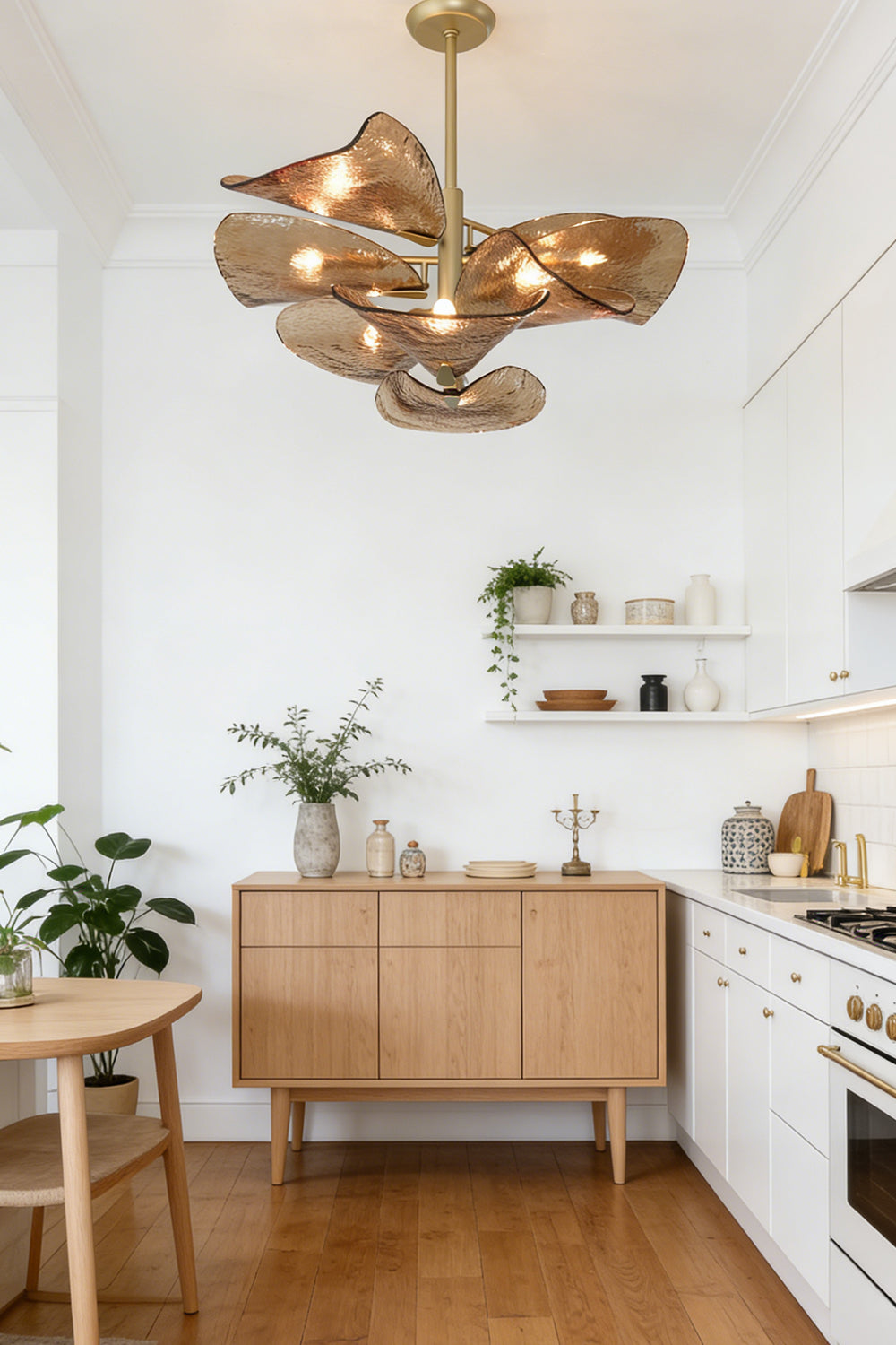 Textured glass wave petal chandelier | Metal, Glass | Hanging in a bright kitchen area above a sideboard | Samu Lamp