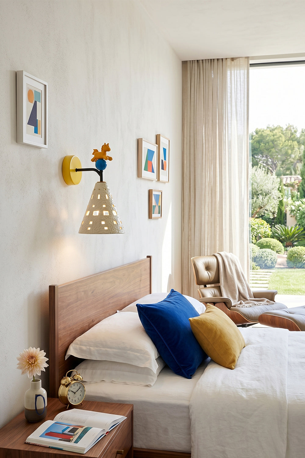 Carousel Horizon Ceramic Wall Sconce | Metal, Resin, Ceramics | Wall-mounted in a bright kid's bedroom beside a bed with vibrant blue and yellow pillows | Samu Lamp Carousel Horizon