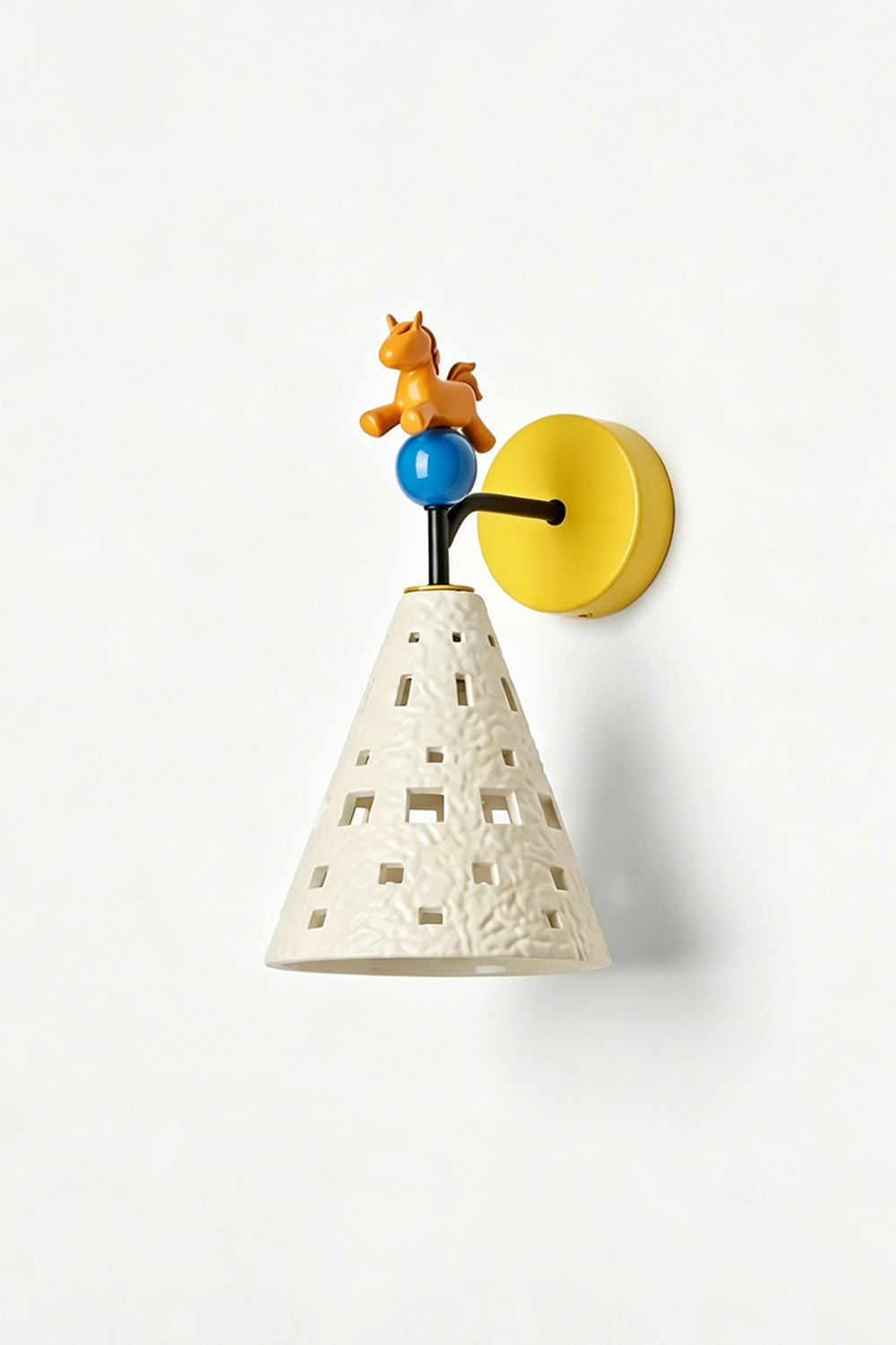 Carousel Horizon Ceramic Wall Sconce | Metal, Resin, Ceramics | Angled view of the illuminated sconce on a plain wall, highlighting its sculptural and playful form | Isolated shot | Samu Lamp