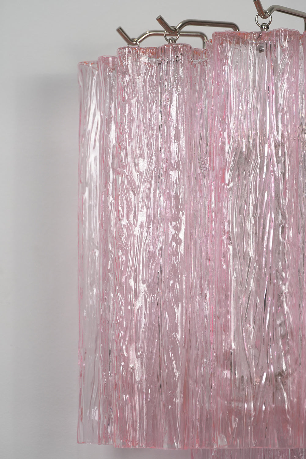 Cascading Prism Pink Glass Wall Light | Glass, Metal | Close-up of the vertical rippled texture on the pink glass prisms | Detail shot | Samu Lamp Cascading Prism