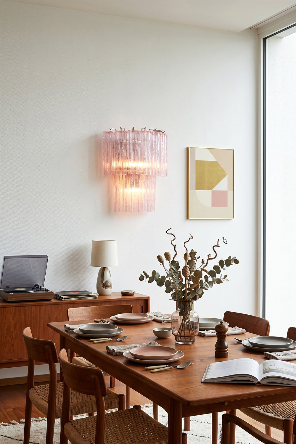 Cascading Prism Pink Glass Wall Light | Glass, Metal | Decorative wall lighting in a modern dining area with a large wooden table | Samu Lamp Cascading Prism