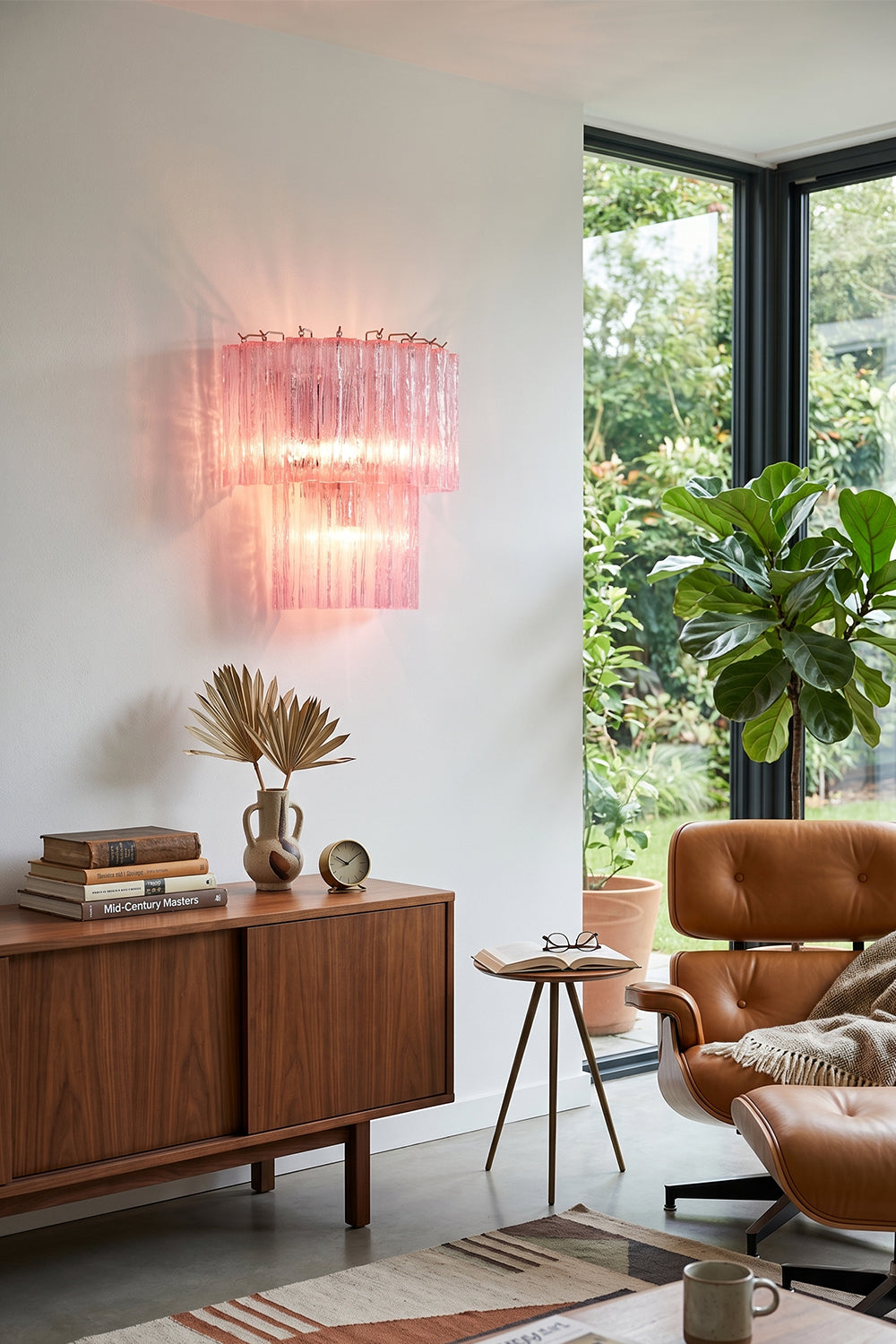 Cascading Prism Pink Glass Wall Light | Glass, Metal | Mounted above a mid-century wooden sideboard in a bright living room | Samu Lamp Cascading Prism
