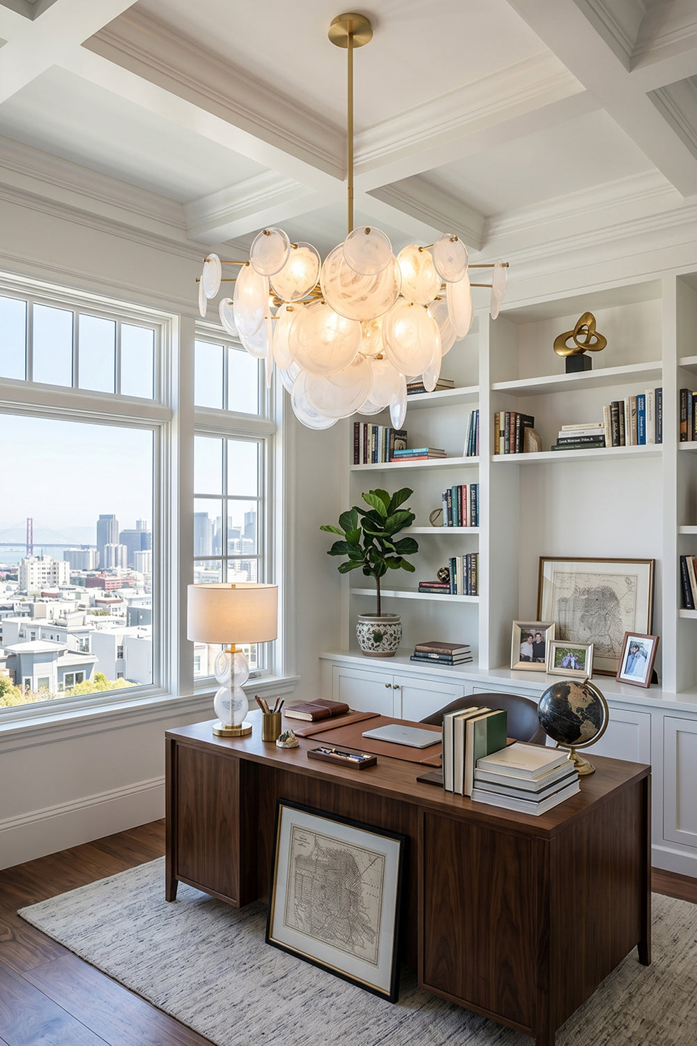 English: Celeste Glass Disc Chandelier | Glass, Metal | Hanging as a luxury statement lighting piece in a bright home office with a dark wood desk and bookshelves near a city-view window | Samu Lamp