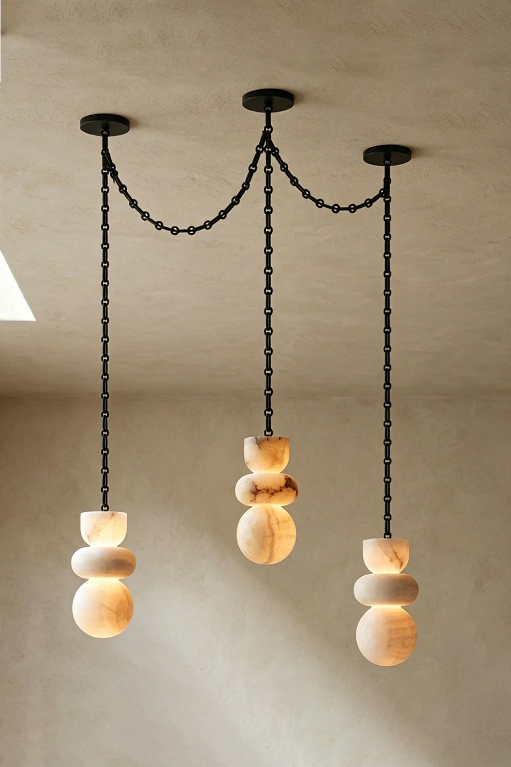 Celestial Alabaster Chandelier | Alabaster, Metal | Three-light swag configuration with organic stone forms | Samu Lamp