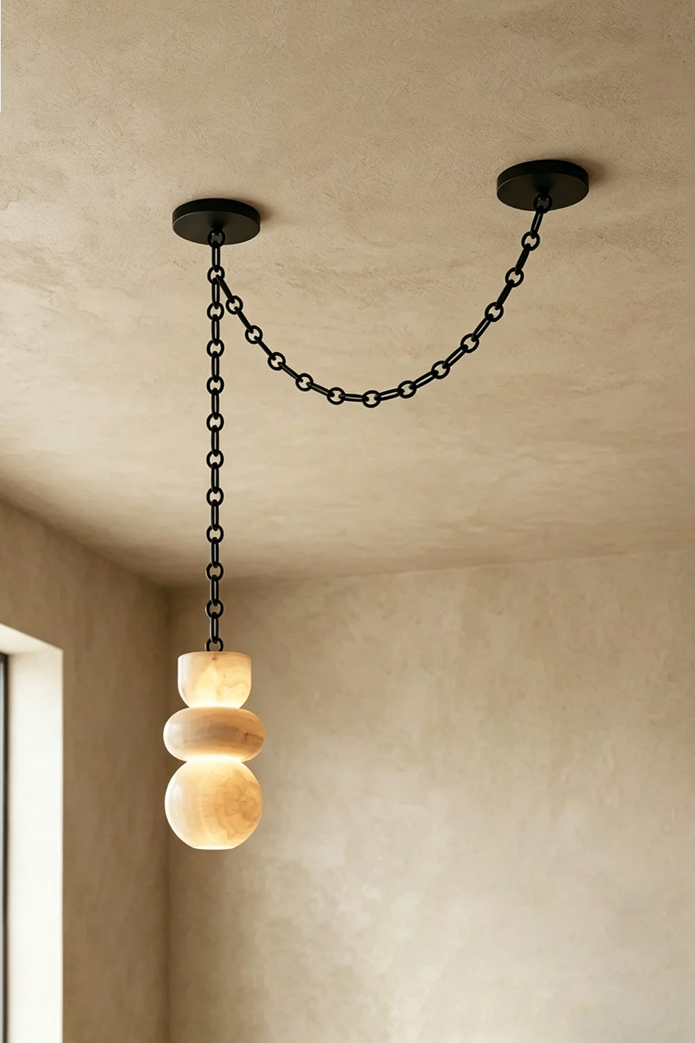 Single Alabaster Pendant | Alabaster, Metal | Swag mount installation view on plain ceiling | Samu Lamp