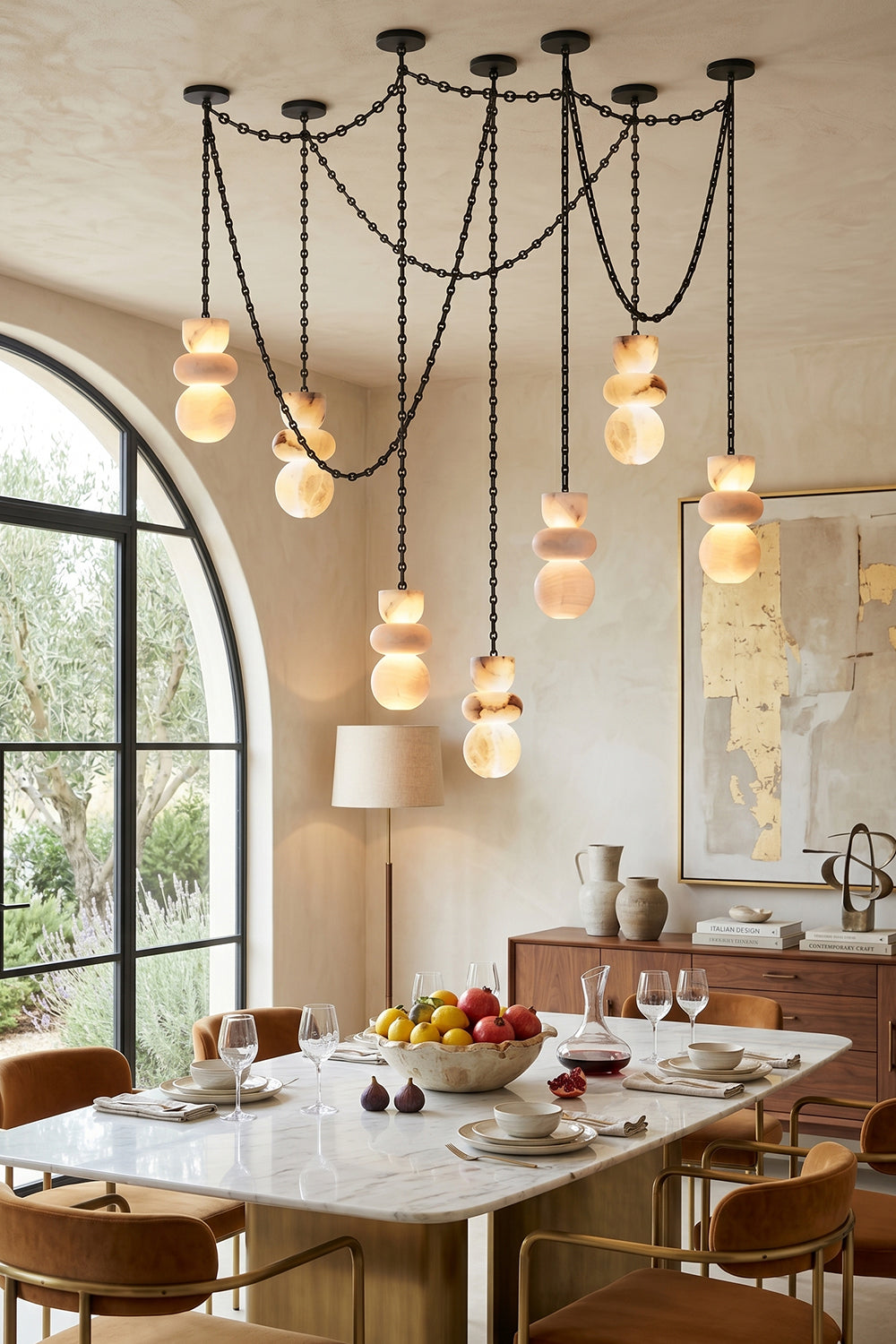 Celestial Alabaster Chandelier | Alabaster, Metal | Lit alabaster shades in a warm modern dining area | Samu Lamp