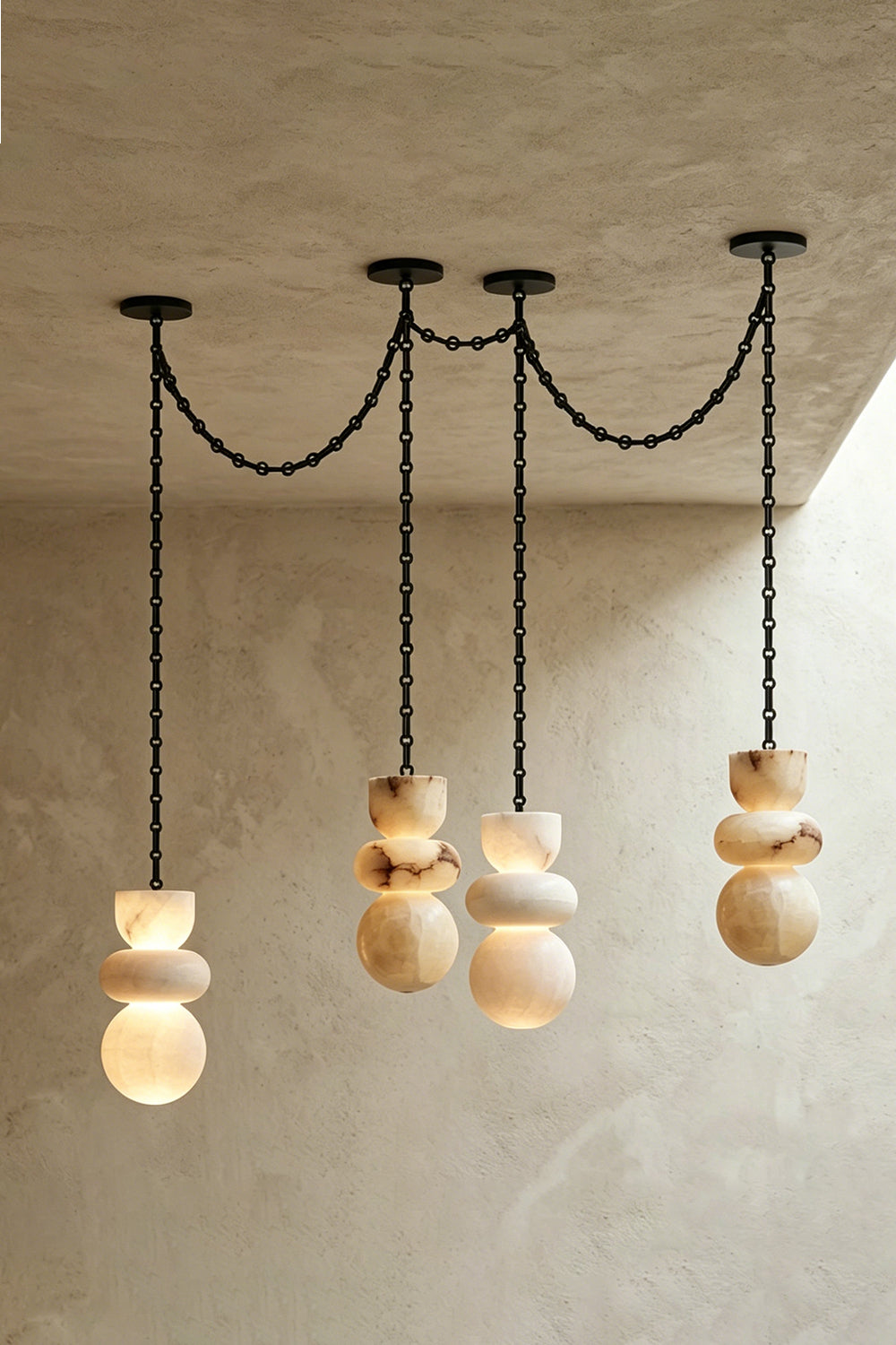 Celestial Alabaster Chandelier | Alabaster, Metal | Linear arrangement of three pendants on plain wall | Samu Lamp