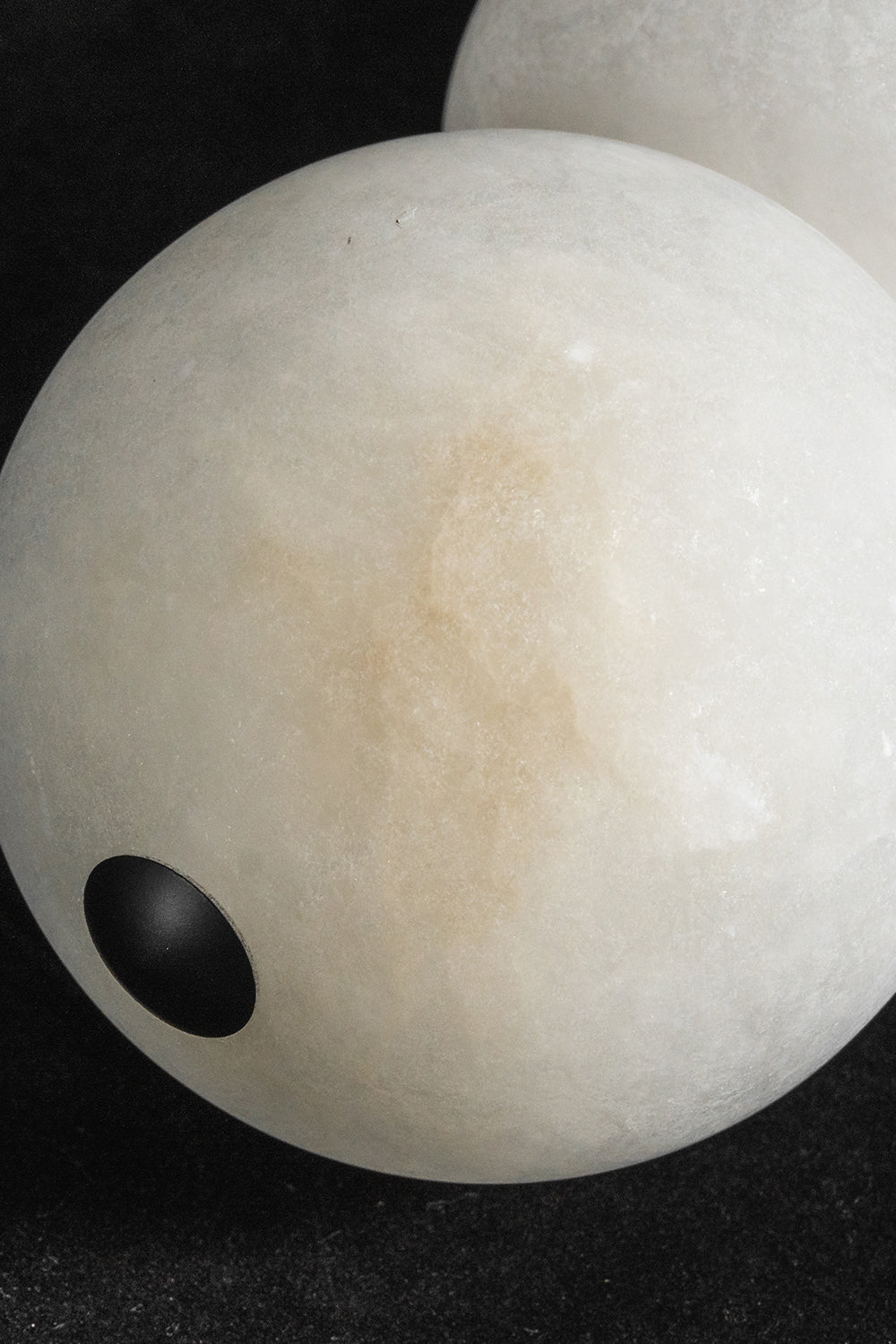 Alabaster sphere detail | Alabaster | Macro shot showing natural veining and unlit stone texture | Samu Lamp