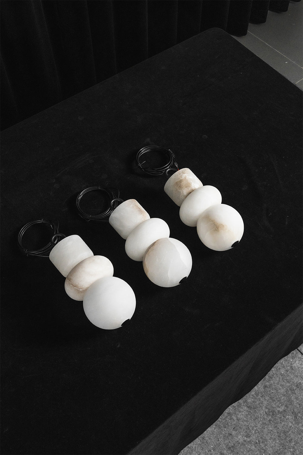 Celestial Alabaster pendants | Alabaster, Metal | Trio of unlit stone shades on dark surface | Samu Lamp