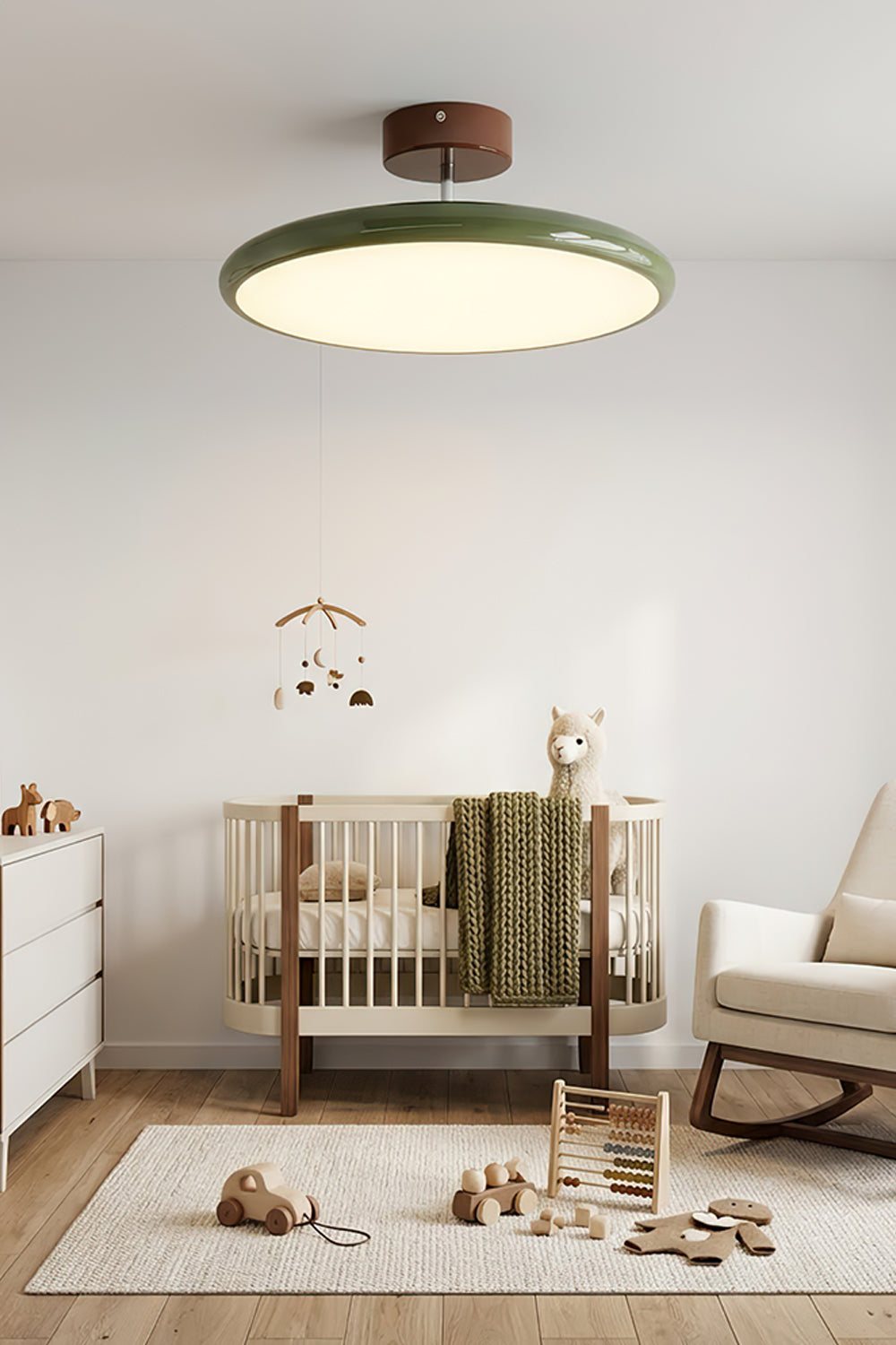 Celestial Disc Lacquered Ceiling Light | Acrylic, Metal | Green lacquered trim variant installed and illuminated in a bright, tranquil nursery with a crib and rocking chair | Samu LampCelestial Disc