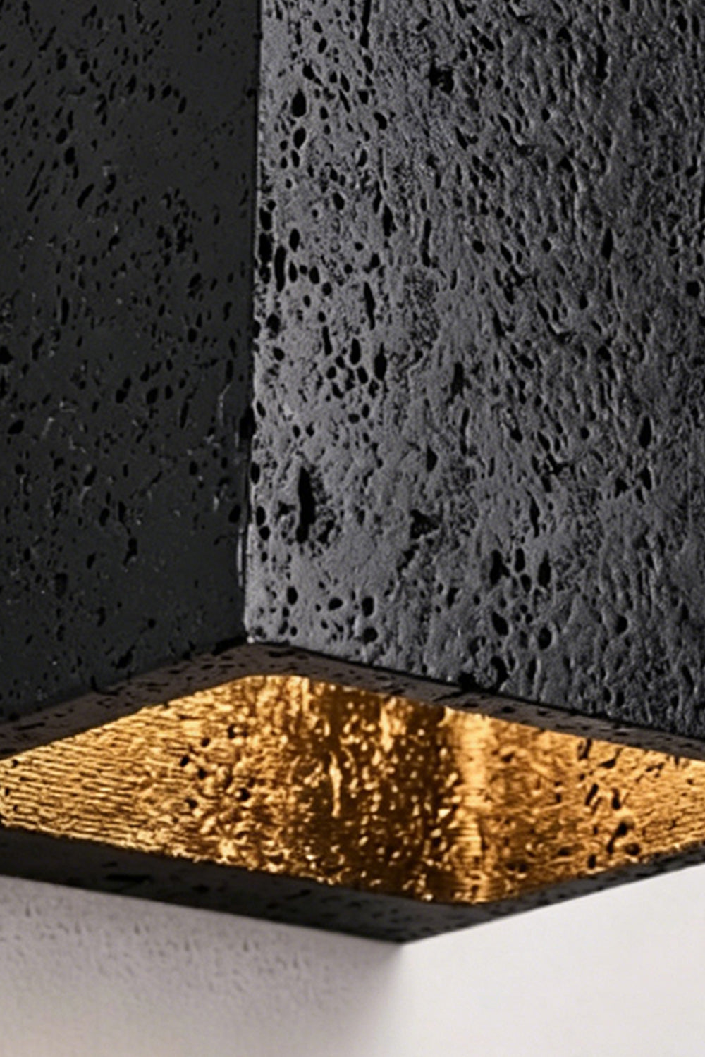 Celestial Tectonic Detail | Black Travertine, Gold Foil | Close-up of porous stone texture and golden lining | Samu Lamp