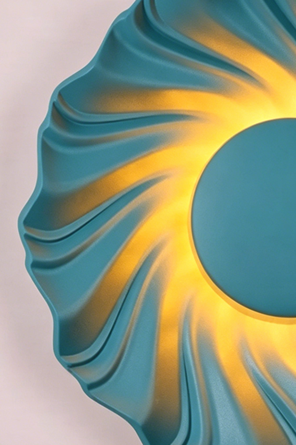 Centripetal Solstice Metal Wall Lamp | Metal, Resin | Close-up of the blue textured lamp, highlighting the vibrant blue concentric ripples and warm glowing light | Samu Lamp
