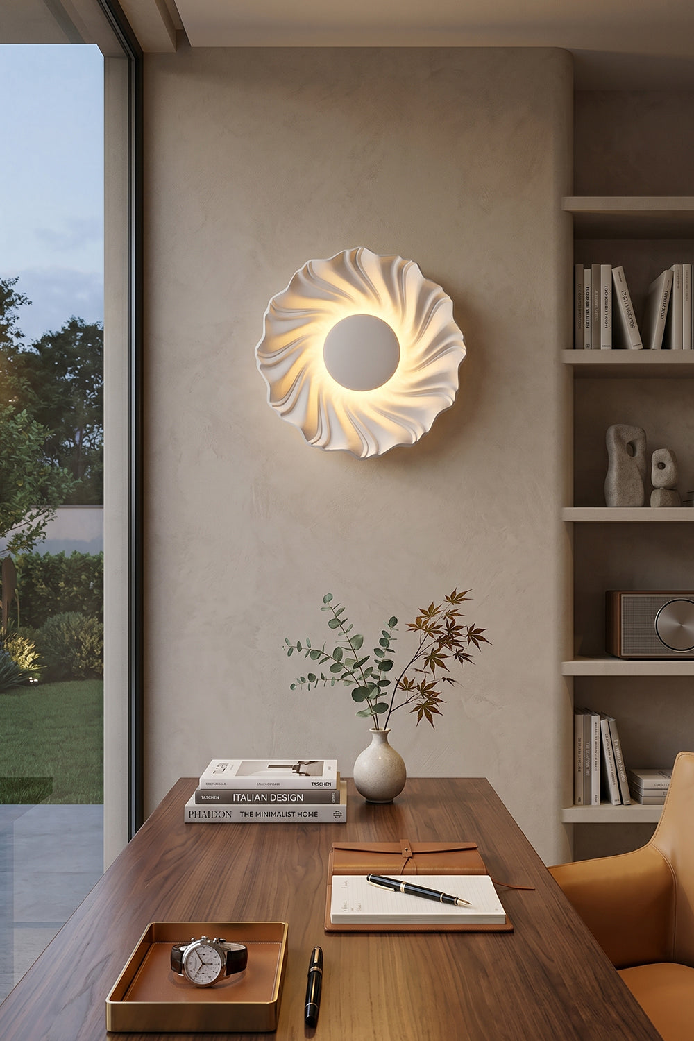 Centripetal Solstice Metal Wall Lamp | Metal, Resin | White textured lamp mounted above a modern dark wood table and chairs in a contemporary open-plan dining and study space | Samu Lamp