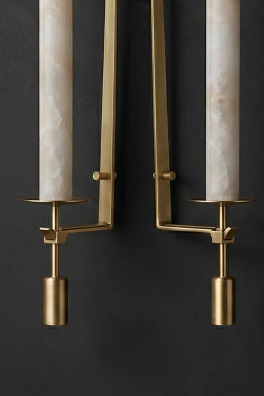 Chantal Twin Alabaster Wall Sconce | Alabaster, Brass | Detailed unlit studio shot of the twin-light brass variant highlighting the symmetrical candle arms and natural stone textures against a charcoal wall | Detail shot | Samu Lamp