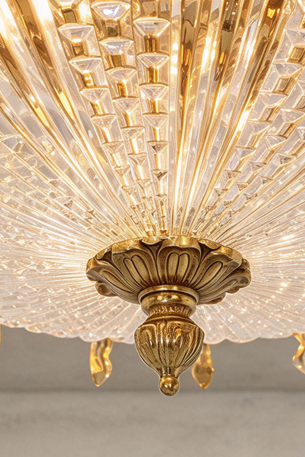 Chaumelle Brass Swag Ribbed Glass Ceiling Light | Ribbed Glass and Brass | Bottom-up perspective showing the ornate brass finial and ribbed glass dome | Samu Lamp