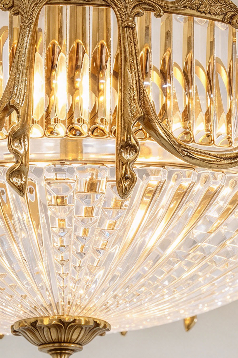Chaumelle Brass Swag Ribbed Glass Ceiling Light | Ribbed Glass and Brass | Close-up detail of the vertical ribbed glass and carved brass frame | Samu Lamp