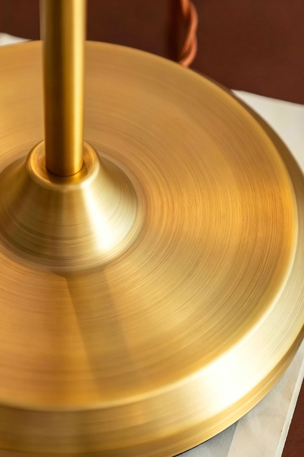 Clara Vintage Pastel Glass Table Lamp | Glass, Metal | Close-up macro focus on the circular brushed brass metal base plate and stem | Detail shot | Samu Lamp