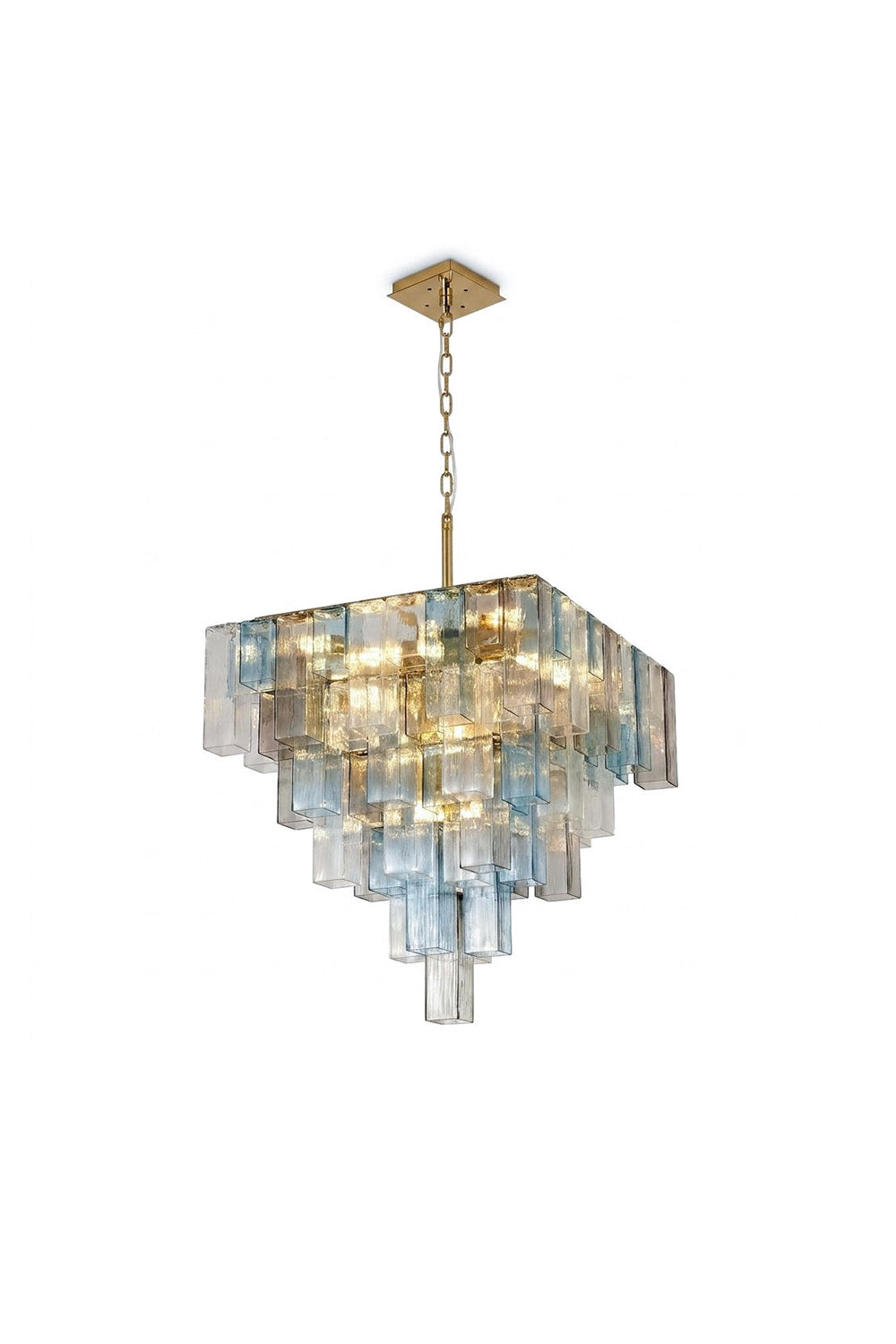 Clarissa Tiered Square Glass Chandelier | Textured Glass, Brass | Isolated lit view of a luxury multi-tiered square chandelier featuring rows of staggered blue, clear, and tinted textured glass panels on a gold brass frame | White background | Samu Lamp