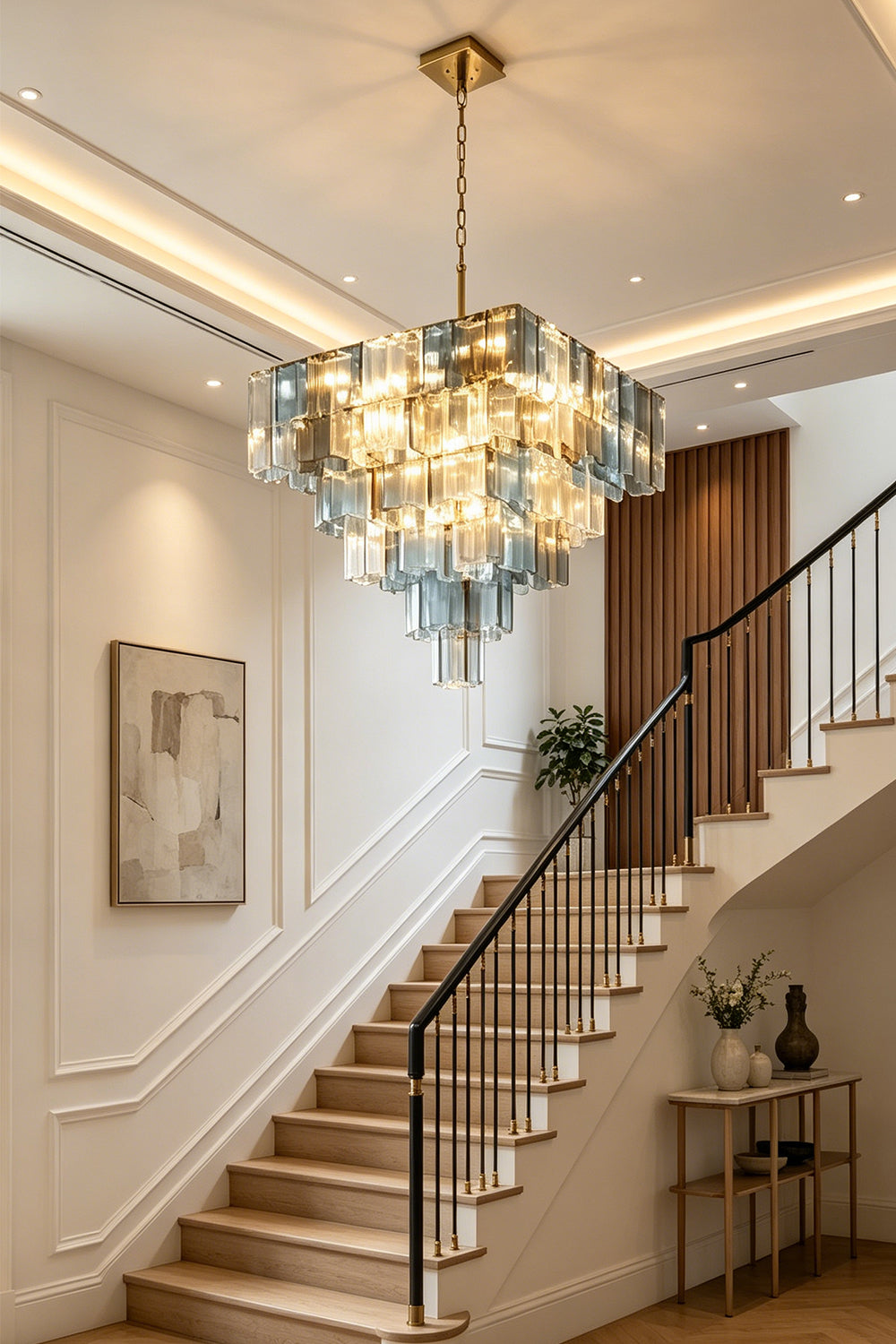 Clarissa Tiered Square Glass Chandelier | Entryway Foyer Lamp | Staged as a grand focal point ceiling light fixture in an upscale hallway right next to an elegant wooden staircase | Samu Lamp