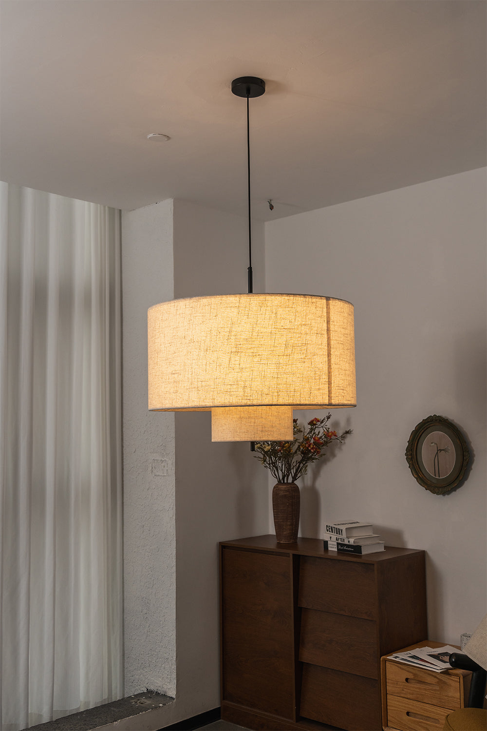 Concentric Veil Fabric Pendant Light | Fabric | Positioned next to a dark wood dresser in a clean interior | Samu Lamp