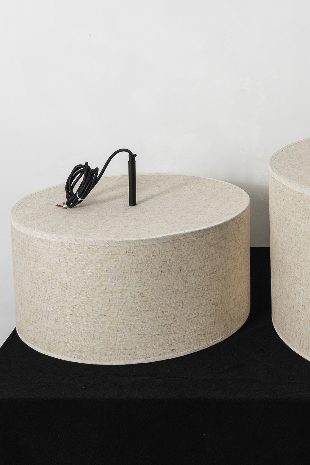 Concentric Veil Detail | Fabric | Close-up of the unlit fabric shade profile on a dark surface | Samu Lamp