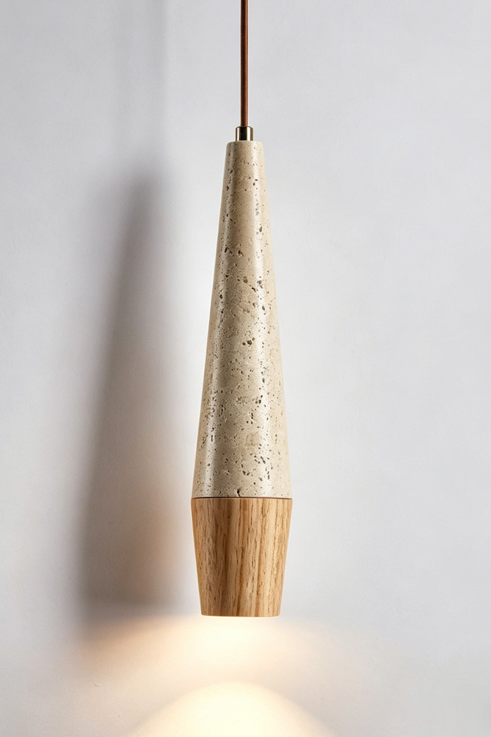 Conical Tiber Travertine Pendant Light | Travertine, Wood | Light wood base detail, lit product shot | Samu Lamp