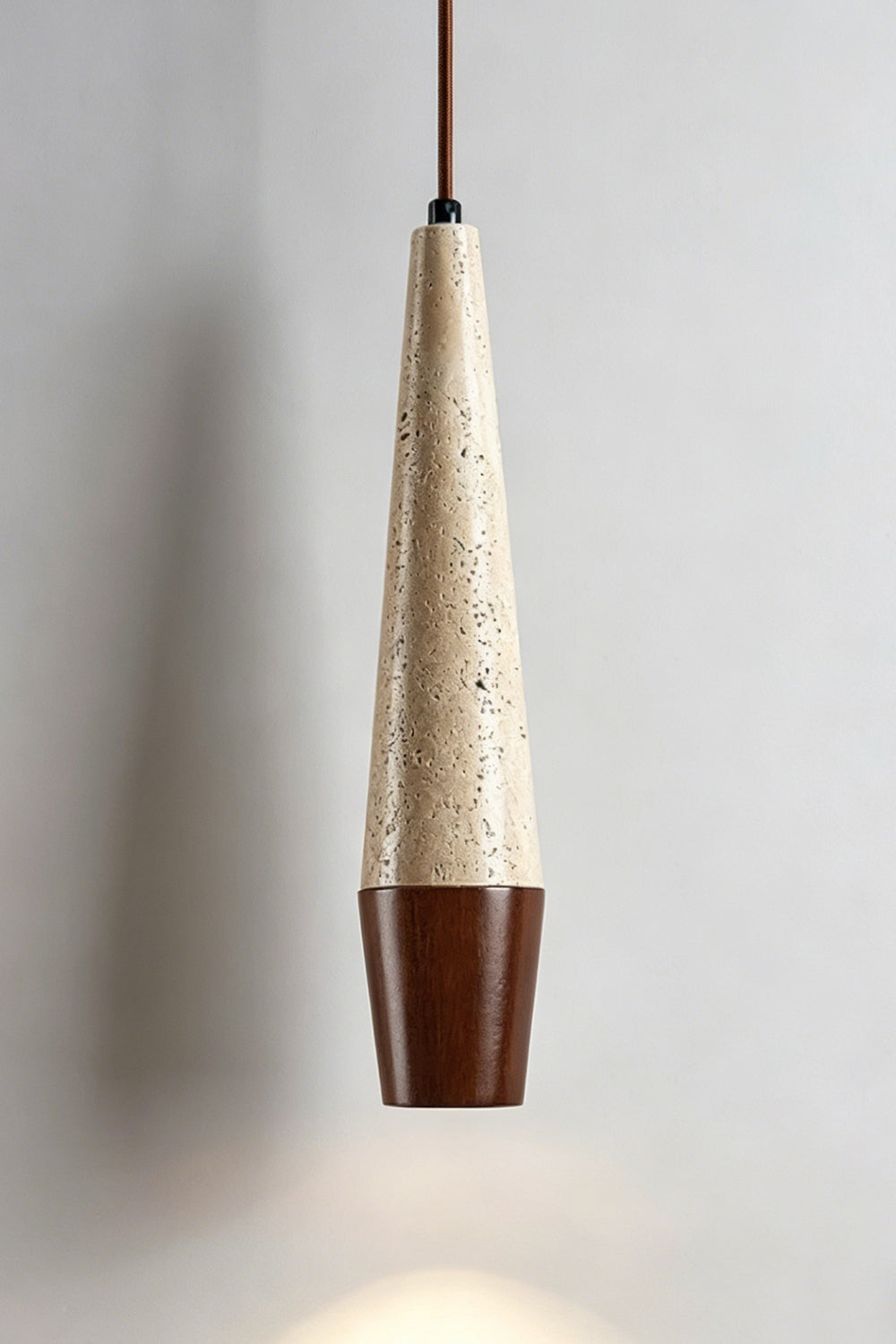Conical Tiber Travertine Pendant Light | Travertine, Wood | Dark wood base detail, lit product shot | Samu Lamp